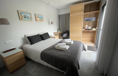 Salema Cabin | Bedroom with private bathroom close to fisherman's trail