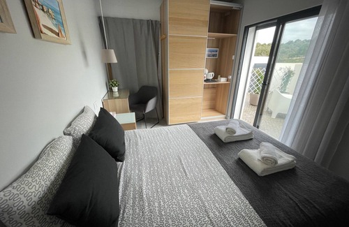 Salema Cabin | Bedroom with private bathroom close to fisherman's trail