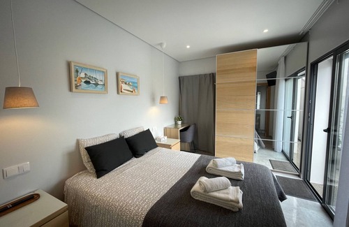 Salema Cabin | Bedroom with private bathroom close to fisherman's trail