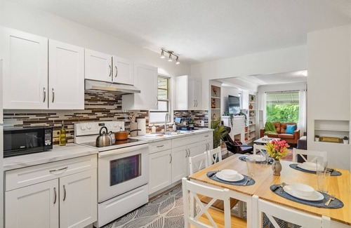 Southwest Edmonton House | Big, fun-filled stay steps from Whyte Ave with yard, games, and coffee bar