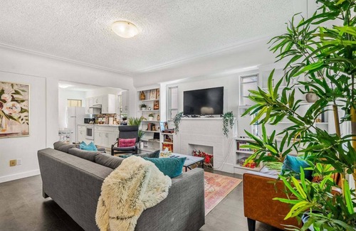 Southwest Edmonton House | Big, fun-filled stay steps from Whyte Ave with yard, games, and coffee bar