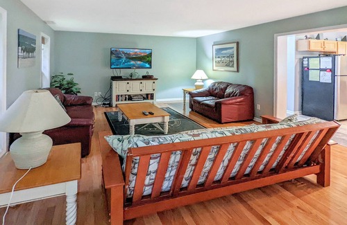 Piney Island House | Blue Heron, modern beach retreat with outdoor shower and screened porch