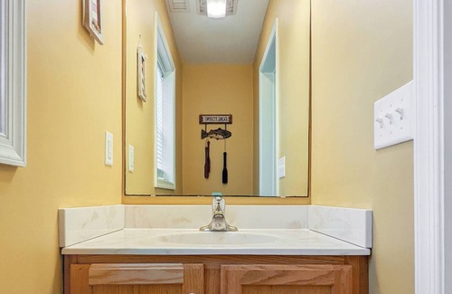Piney Island House | Blue Heron, modern beach retreat with outdoor shower and screened porch