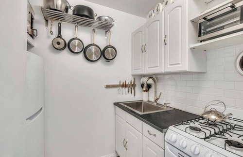 Montauk House | Bohemian-style hotel unit with ample natural light, a cozy seating area,.