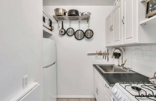 Montauk House | Bohemian-style hotel unit with ample natural light, a cozy seating area,.