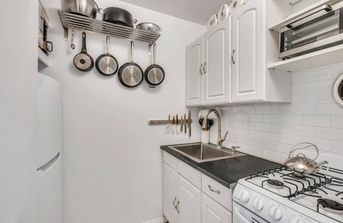Montauk Apartment | Bohemian-style hotel unit with ample natural light, a cozy seating area,.