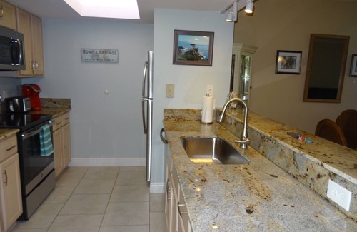 Bonita Bay Condo | Bonita Bay - Lake Frontage! Ground floor Bldg E