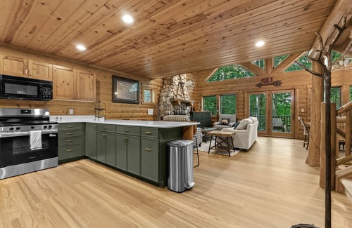 Boyne City Cottage | Boyne Mountain Cabin with Hot Tub Next to Skiing and Golf!