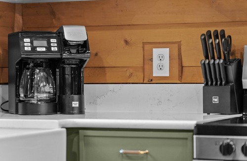 Boyne City Cottage | Boyne Mountain Cabin with Hot Tub Next to Skiing and Golf!