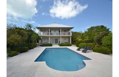 Providenciales Apartment | Breezy, eco-friendly, with pool and lagoon view