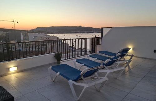 Għadira Apartment | Bright Coastal Penthouse with Huge Terrace Overlooking the Sea- Ghadira Mellieha