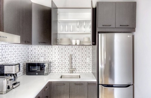 Ukrainian Village Apartment | Bright East Village 1BR w/W/D, on prime corner, by Blueground