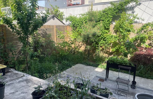 East Williamsburg House | Bright & Spacious Garden Apartment with workspace in Vibrant Bushwick + Parking!