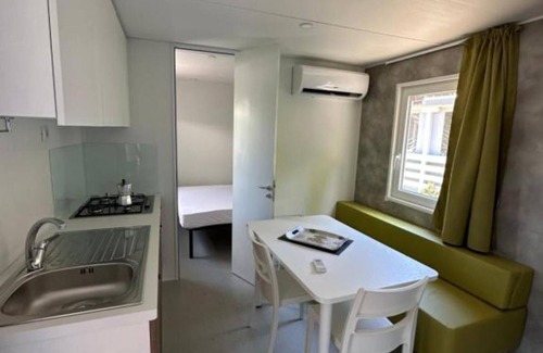 Oliveto Lario House | Bungalow 'Casa Mobile 8' with Private Terrace, Shared Garden and Air Conditioning