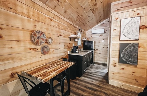 Hartwell RV Rental | Cabin #8: Studio style layout with kitchenette and a large gravel parking pad beside the cabin for easy boat or trailer storage.