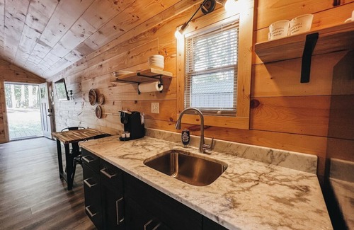 Hartwell RV Rental | Cabin #8: Studio style layout with kitchenette and a large gravel parking pad beside the cabin for easy boat or trailer storage.