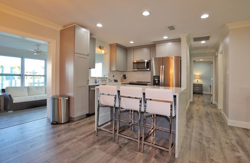 Vanderbilt Beach House | *CANAL FRONT HOME W/BOAT DOCK*HEATED POOL & SPA*WALK TO VANDERBILT BEACH*