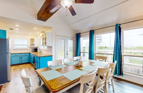 Spanish Grant House | Canal view retreat with vaulted ceilings & three-story observation deck