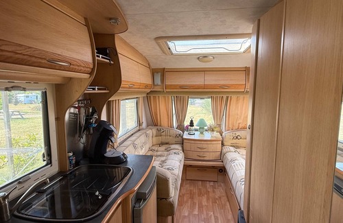 Champsac RV Rental | Caravan 'Vue Sur L'étang' with Lake View, Shared Pool and Private Terrace