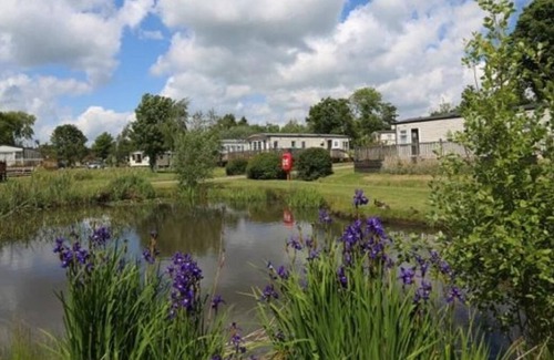 Saxmundham House | Caravan with decking at Carlton Meres Park in Suffolk ref 60059M