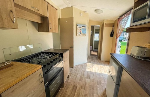 Colchester House | Caravan with large decking at Coopers Beach Holiday Park ref 49036TS