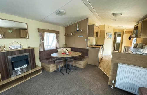Colchester House | Caravan with large decking at Coopers Beach Holiday Park ref 49036TS