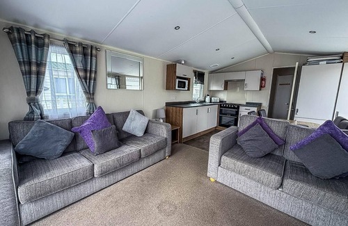 Colchester House | Caravan with large decking at Coopers Beach Holiday Park ref 49012SV