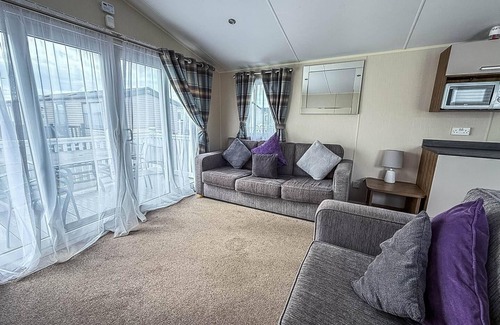 Colchester House | Caravan with large decking at Coopers Beach Holiday Park ref 49012SV