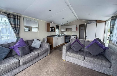 Colchester House | Caravan with large decking at Coopers Beach Holiday Park ref 49012SV