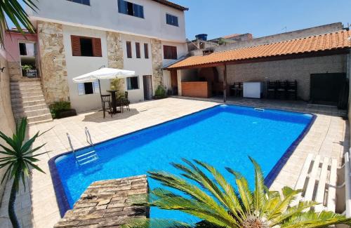 Pauliceia House | Casa com piscina e laser