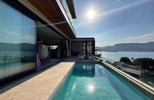Itaguassu House | Casa com piscina aquecida, jacuzzi e 60 m da praia
