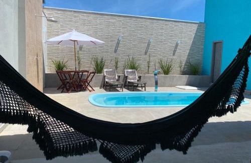 Prado House | Casa com piscina e um quarto com ar split pé na areia a 50 metros da praia