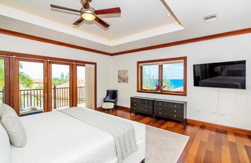 George Town Villa | Casa Luna 4 - Gated Seaside Village with Shared Pool, Jacquzi, & Beach Cove