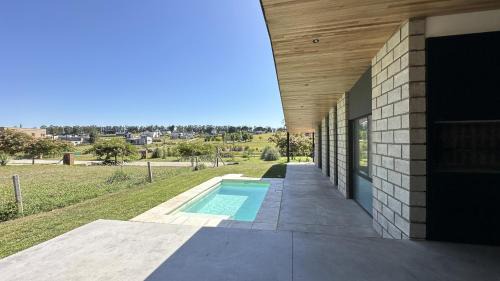 Colonia Chapadmalal House | Casa Pit - Casa en chapa con pileta Barrio Privado 6PX I Hola Sur