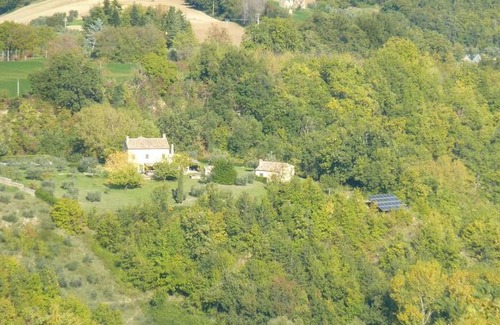 Santa Vittoria in Matenano Villa | Casale Oliva in a landscape of oaks, olive e cherry trees
