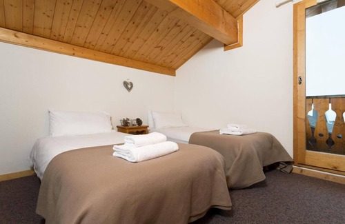 Plagne Soleil Ski Chalet | Chalet, 100m from resort center, terrace, balcony, fireplace or stove, parking, tv, 60-70m²