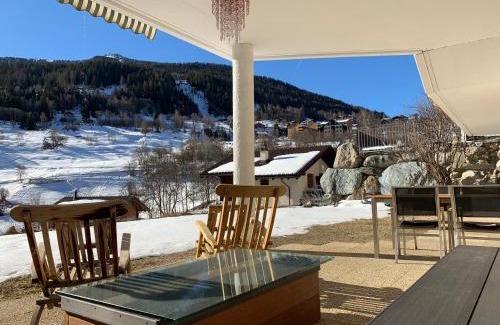 Vercorin Ski Chalet | Chalet Fleuris ground floor with garden sauna terrace and Alps view