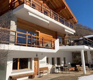 Vercorin Ski Chalet | Chalet Fleuris ground floor with garden sauna terrace and Alps view