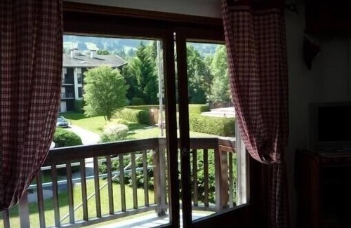 Megeve Apartment | Character apartment with fireplace in residence with summer swimming pool.
