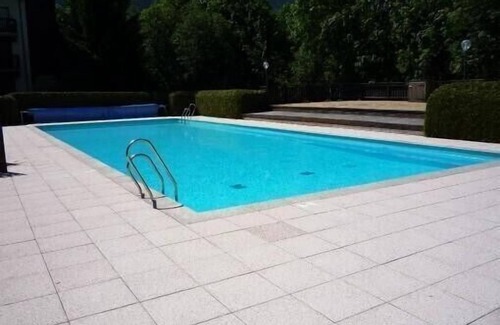 Megeve Apartment | Character apartment with fireplace in residence with summer swimming pool.