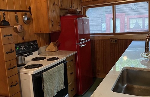 Lake George Cottage | Charming 1920's cottage on Lake George w/boat slip & sundeck.