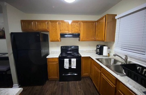 Greensboro House | Charming 2-bedroom townhome with WiFi, AC in Greensboro Big screen Smart TVs