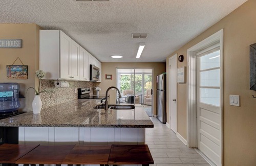 New Smyrna Beach House | Charming 2 BR Beachside Escape - Pet Friendly and just steps from the sand!