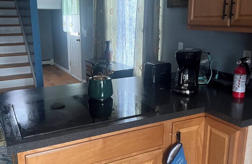 Fiskeville Apartment | Charming 3-bedroom duplex with study space, WiFi in cool Hope Scituate.