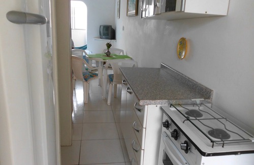 Pitangueiras Apartment | Charming kitnet ideal for couple 100 meters from the beach in Pitangueiras