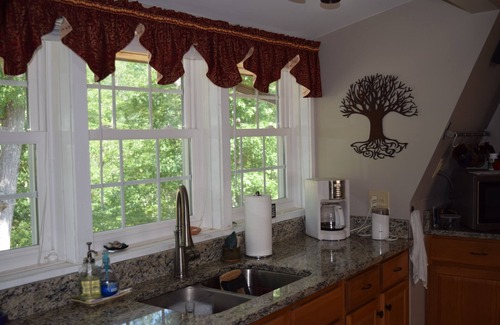 Great Cacapon House | Charming mountaintop cabin with hot tub, pool table, and breathtaking views