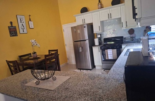 Spanish Town House | Charming sanctuary in the picturesque Caymanas Estates area.