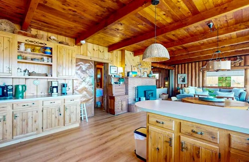 Oak Harbor House | Charming water view retreat with a wood-burning fireplace, deck, grill, and W/D