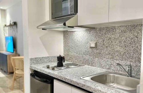 Samana Apartment | Chic Studio with King size Bed, Balcony with Spectacular Bay View, Pool, Full AC