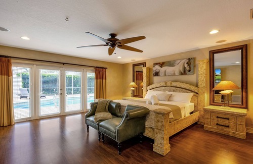 Parkland House | City Oasis is a Gorgeous Home with a Pond, Pool table, Poker, and Heated Pool!